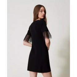 Abito corto in maglia con manica in tulle nero vista posteriore indossata